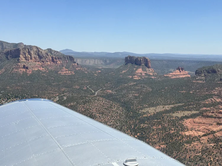View from a Cessna wing over the red rocks near Sedona, Arizona